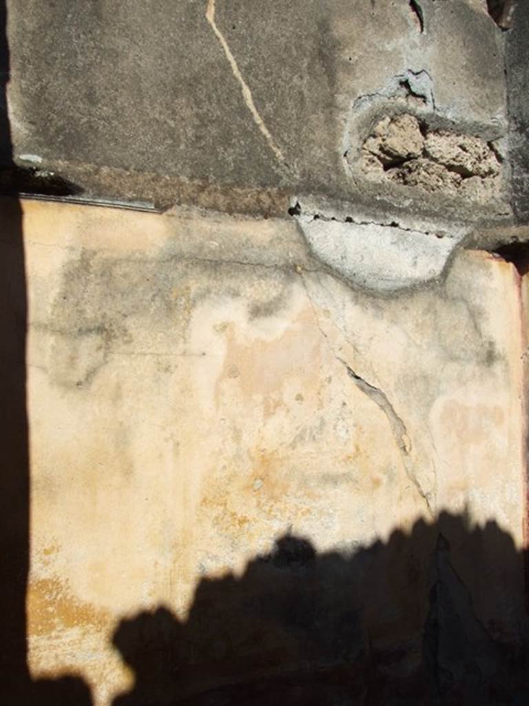 VI.14.20 Pompeii. March 2009. Room 9, north wall.
According to PPM � (room e) -
North wall; red panelled zoccolo with painted plants at the sides and Ibis (disappeared) in the centre (disappeared): the middle zone, nearly all faded, had an aedicula in the centre with a painting of a crowned Dionysus, talking to a crowned female figure, to the sides semi-panels with �carpet borders� and corner volutes, at the top of the wall was a stucco cornice with palmettes. IV Style.  
See Carratelli, G. P., 1990-2003. Pompei: Pitture e Mosaici: Vol. V. Roma: Istituto della enciclopedia italiana, p.269, no.6.
According to Sogliano: cubiculum on the right of the entrance corridor, (height: 0.52 x length: 0.42).
In the middle stands crowned Dionisus with his right elbow resting on a base or pillar and with the thyrsus in the left hand. On the right you can see a female figure, also crowned, who is talking to him by putting, as it seems, the right hand/arm on the shoulder.
See Sogliano, A., 1879. Le pitture murali campane scoverte negli anni 1867-79. Napoli: Giannini, (p.40, no.166).
(cubicoli a destra dell�androne �
Nel mezzo sta in piedi Dioniso coronato col gomito destra appoggiato ad una base o pilastri e col tirso nell sinistro. A destra si vede una figura muliebre, pure coronate, che a lui si rivolge mettendogli, come pare, la destra sulla spalla.
Giorn.Scavi Pomp., n.s.III, p.100. Bull. Inst, 1876, p.20.).
Kuivalainen comments �
�Young Bacchus with either Venus or Ariadne on account of the crown, in the latter�s case pertaining to the wedding diadem, the future corona borealis.
See Kuivalainen, I., 2021. The Portrayal of Pompeian Bacchus. Commentationes Humanarum Litterarum 140. Helsinki: Finnish Society of Sciences and Letters, (p.126, D3).

