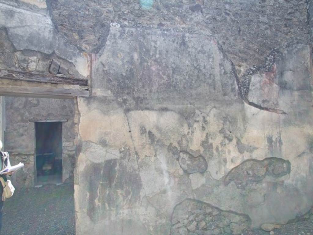 VI.14.20 Pompeii. March 2009. Room 17. South wall with door to portico area.