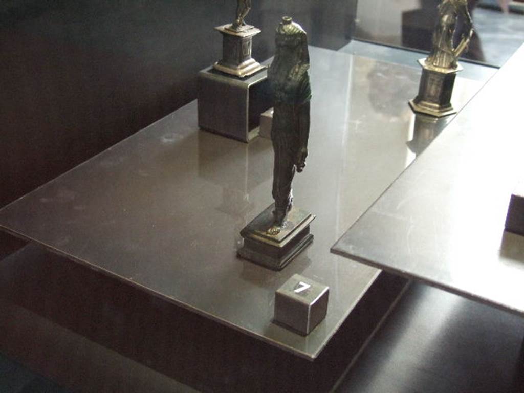 VI.14.27 Pompeii. Found in room �b�. Bronze statuette of Isis found in house.  
Now in Naples Archaeological Museum.
