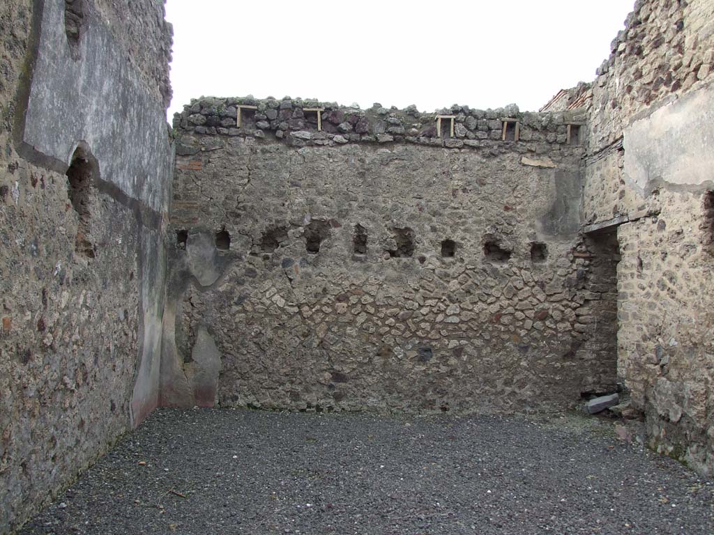 VI.14.28 Pompeii. December 2006. West wall.
According to Della Corte, in the north-west corner was a doorway linking with VI.14.30. 
It led to steps to the upper floor, which had a further two rooms.
