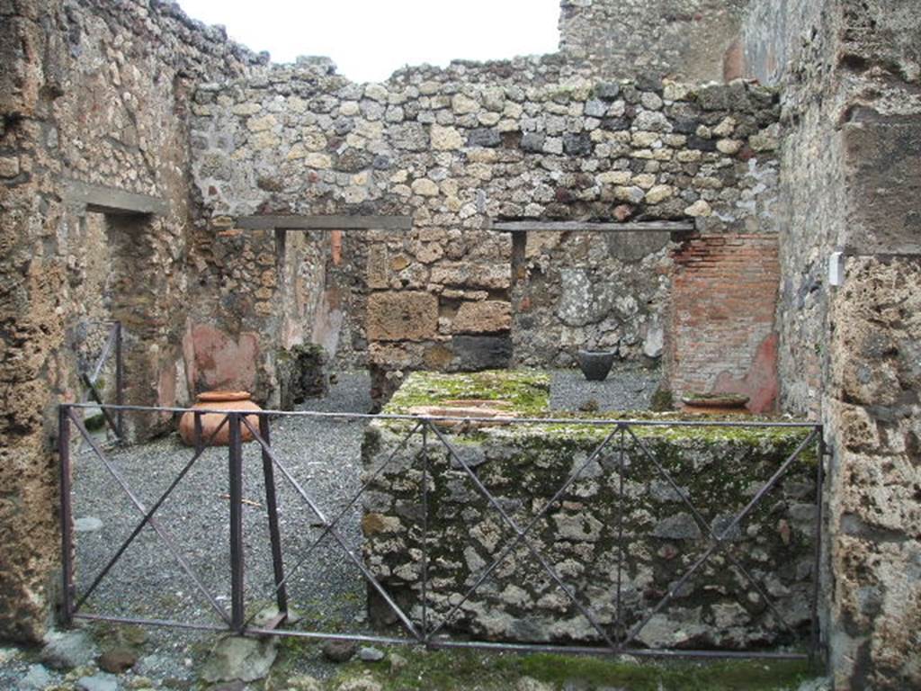 VI.14.36 Pompeii. December 2004. Looking east across bar-room. On the west side of the doorway in the north wall of the bar-room, four paintings of “tavern-life” including graffiti were discovered. These are now in the Naples Archaeological Museum. Inventory number: 111482.
