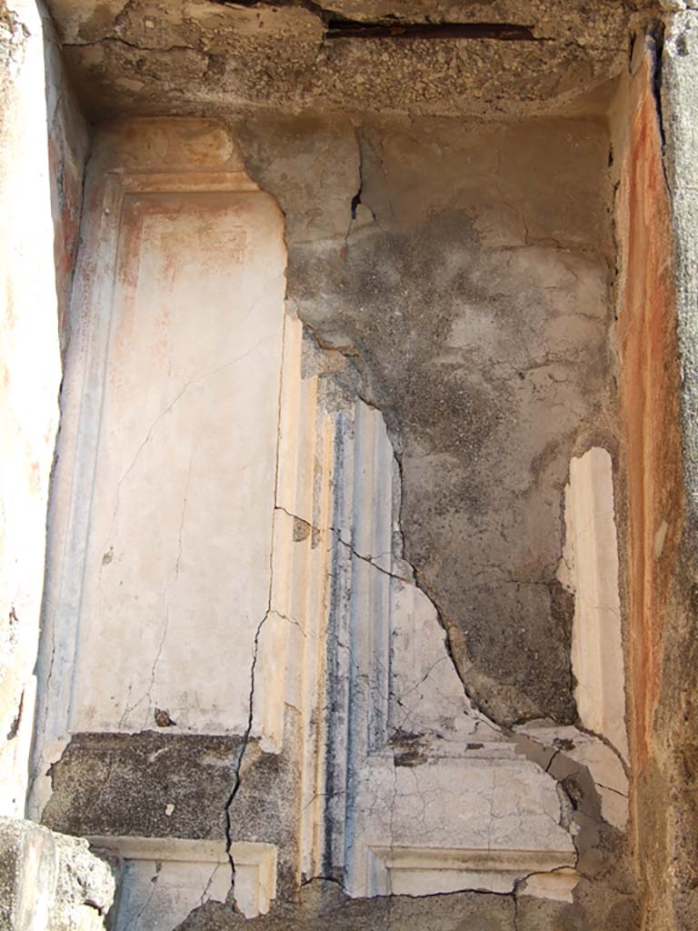 VI.14.43 Pompeii. December 2007.
Room 6, cast of stucco door in basso-relief, showing preserved outline of a two-shutter door leading to corridor.
