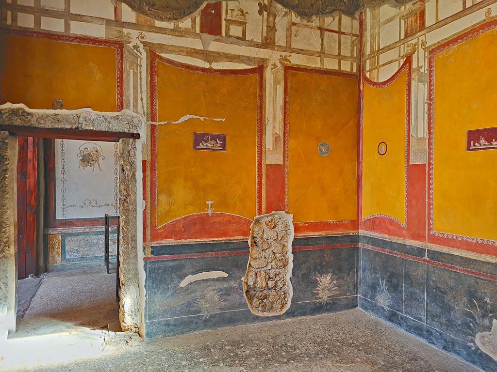 VI.15.1 Pompeii. April 2023.
Looking north towards wall with doorway into north exedra (room p), and north-east corner, on right. Photo courtesy of Giuseppe Ciaramella.