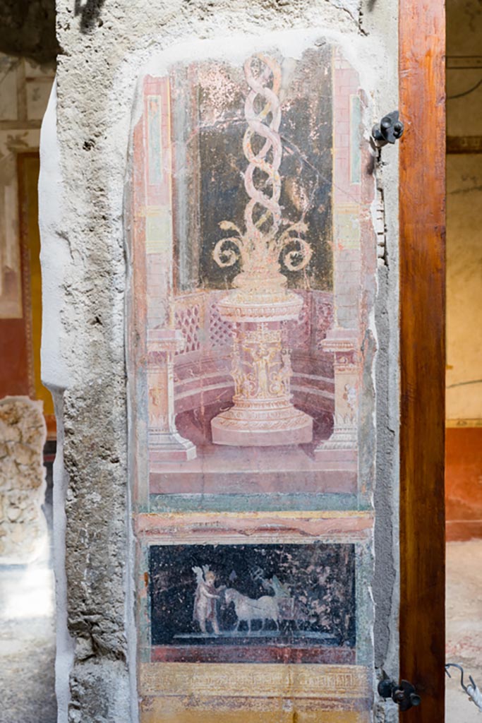 VI.15.1 Pompeii. March 2023.
Painted panels on atrium wall between doorway to north ala, on left, and cubiculum g, on right.
Photo courtesy of Johannes Eber