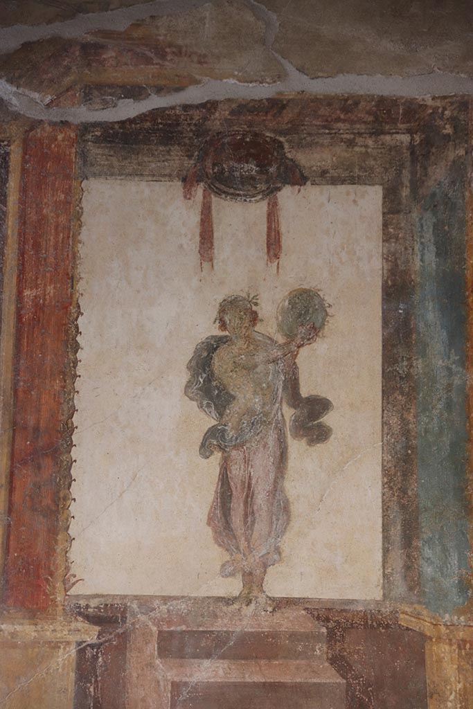 VI.15.1 Pompeii. October 2024.
Painted figure of Muse Urania, from west end of south wall of oecus. Photo courtesy of Klaus Heese.