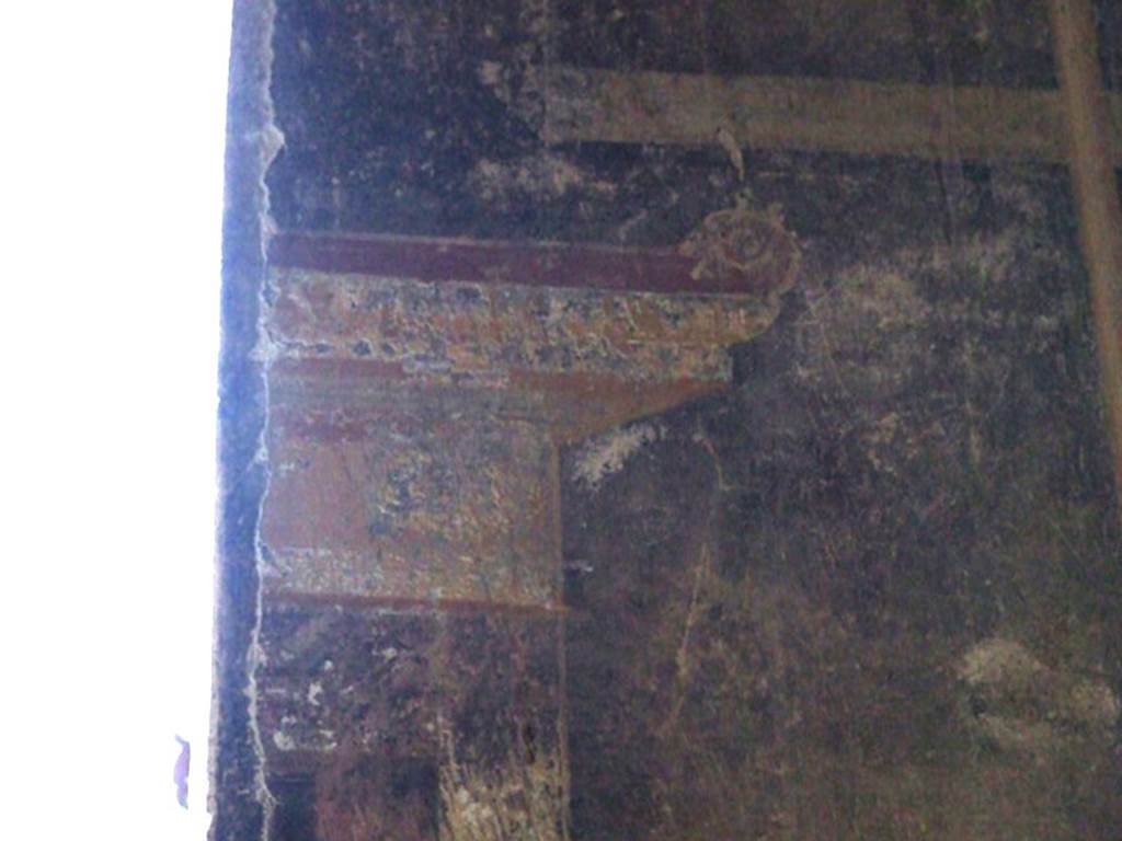 VI.15.6 Pompeii. March 2009. Room 15, detail of wall decoration on east side of window, on upper level of north wall of triclinium.