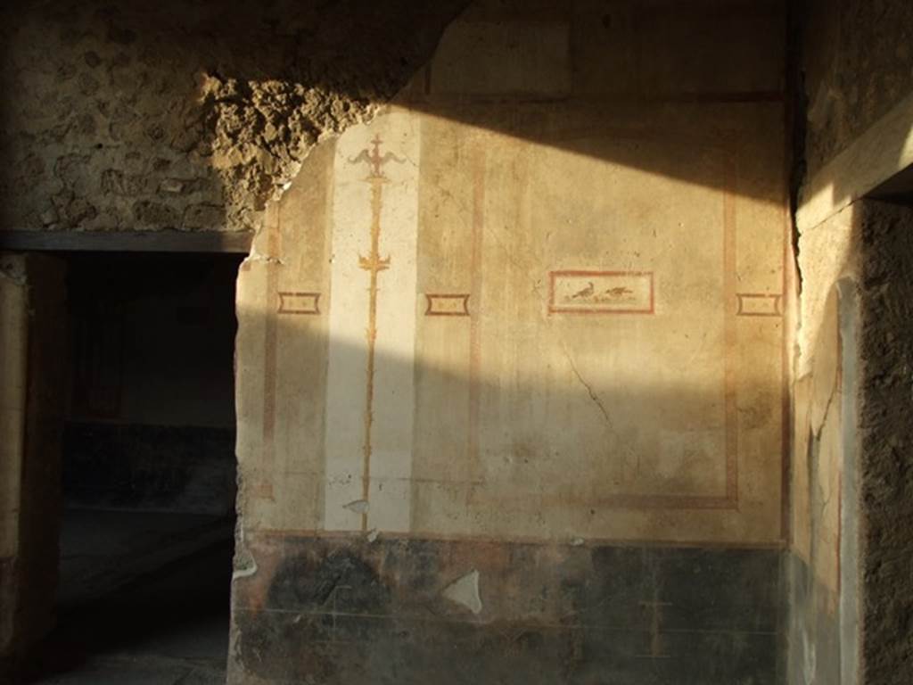VI.15.8 Pompeii. December 2007. North wall of the portico and doorway (on left) to atrium.