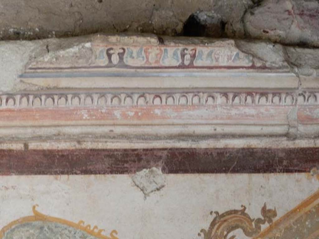 VI.15.8 Pompeii. May 2015. Detail of stucco on upper west side of centre of south wall. Photo courtesy of Buzz Ferebee.