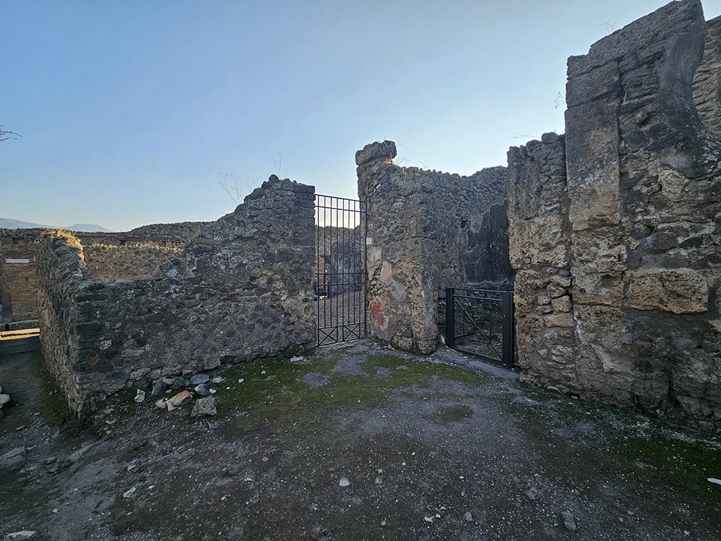 VI.16.4 Pompeii, in centre. November 2024. 
Looking south-west from Via del Vesuvio towards entrance doorway, with VI.16.5, centre right. Photo courtesy of Annette Haug.
