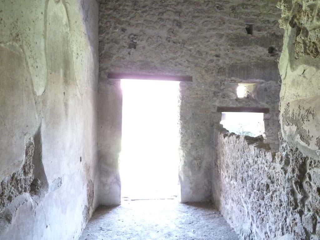 VI.16.7 Pompeii. May 2010. Room J, steps to upper floor, looking south to portico.