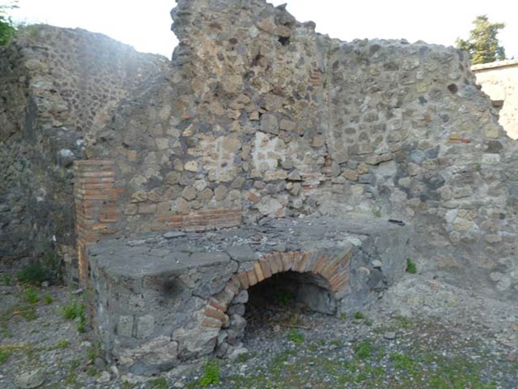 VI.17.1 Pompeii. May 2011. Hearth on north side of entrance doorway.