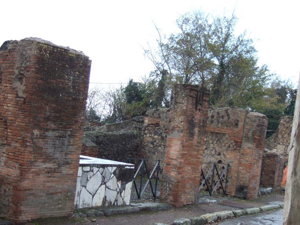 VI.17.4 and VI.17.3 Pompeii. December 2005. Looking north-west along Via Consolare.