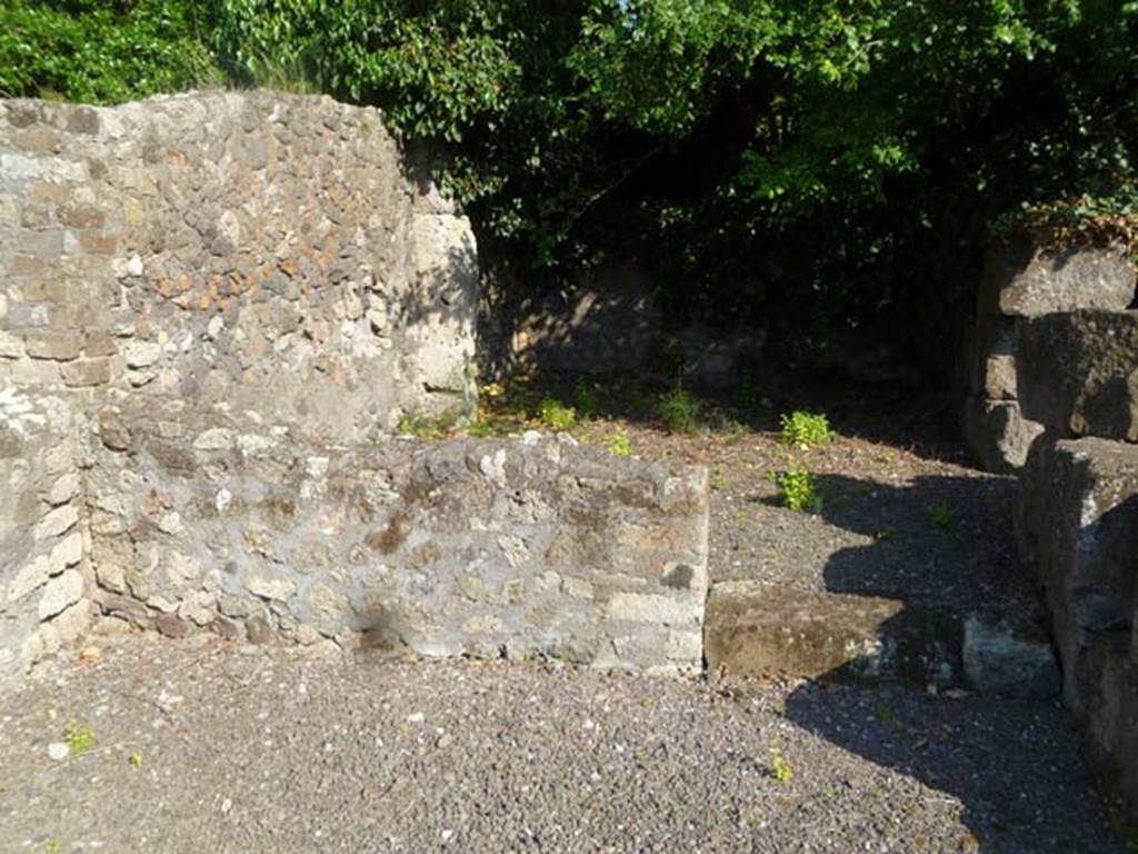 VI.17.4 Pompeii. May 2011. Looking south towards doorway to first room in south-east corner at rear of bar.