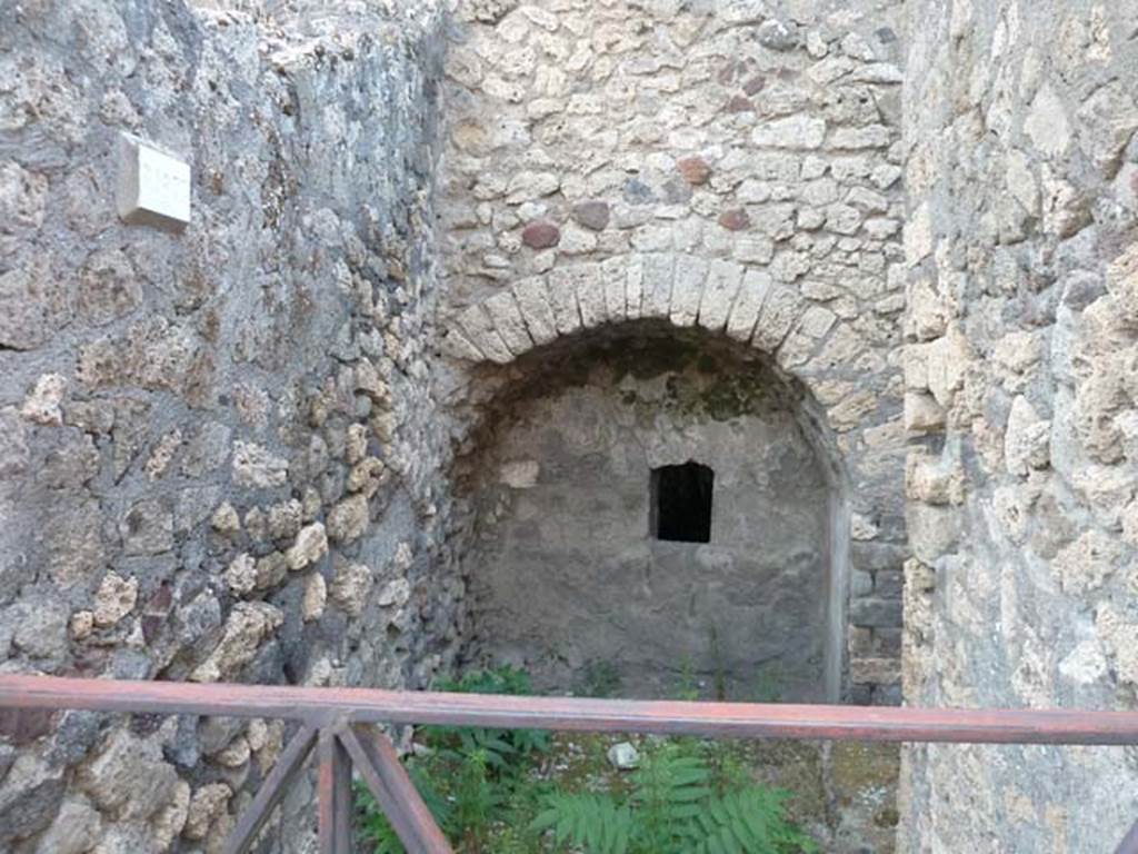 VI.17.11 Pompeii. September 2015. Looking west to blocked doorway to lower levels.
On the right is the entrance to the stairs that would have led up to the atrium. 
