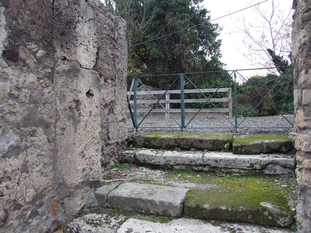 VI.17.13 Pompeii. December 2007. Door pillars and vestibule with two steps.