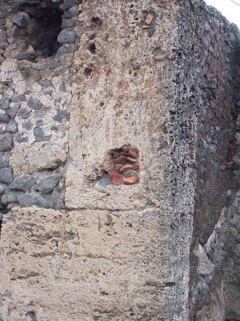 VI.17.13 Pompeii. December 2005. Detail of north wall of the atrium with terracotta infill.