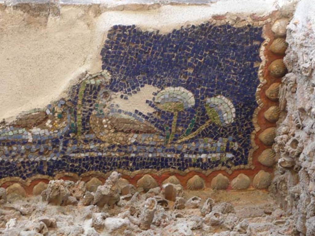 VII.1.8 Pompeii. May 2012. Nymphaeum G, west wall, detail of north end of mosaic at top of niche. Photo courtesy of Buzz Ferebee.