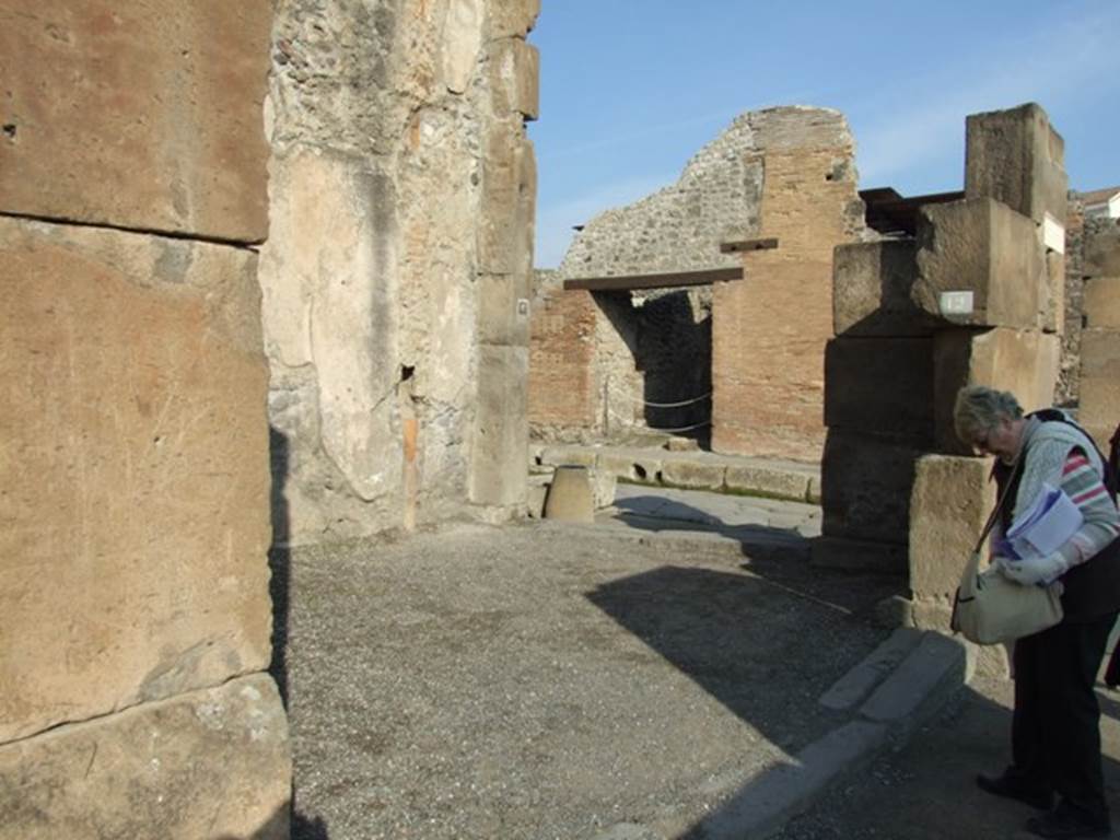 VII.1.12 Pompeii. December 2007. Entrance on Via dell�Abbondanza. 
Looking east towards VII.1.13 entrance on Via Stabiana. For graffiti, found in August 1853, between VII.1.11 and 12, pilaster on the left, see VII.1.11.

