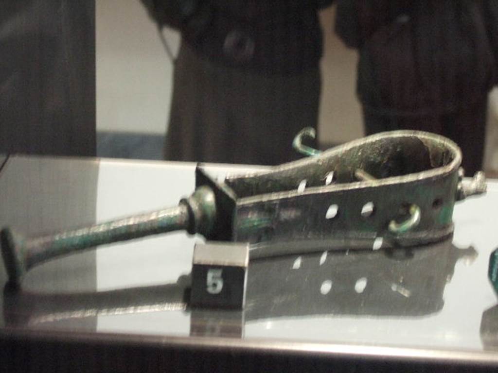 Bronze sistrum found in VII.2.18.  Now in Naples Archaeological Museum.
