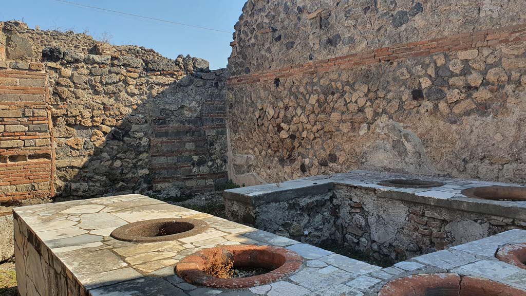 VII.2.32 Pompeii. July 2021. Looking north-east across counter towards remaining stucco on east wall, and north-east corner.
Foto Annette Haug, ERC Grant 681269 D�COR.

