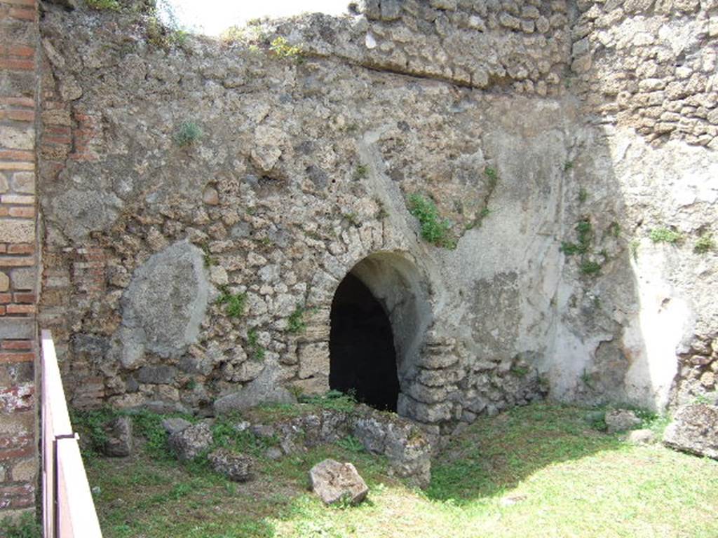 VII.2.41 Pompeii. May 2006.  West wall with entrance to cellar.