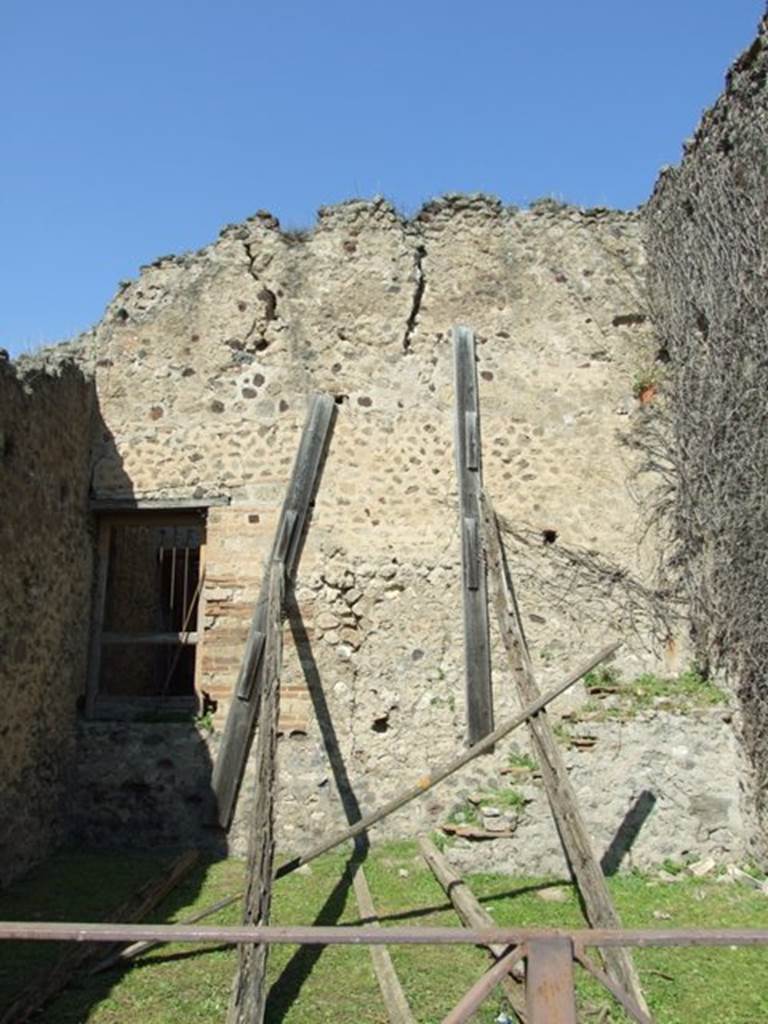 VII.2.42 Pompeii. March 2009. North wall of shop, with doorway and steps.