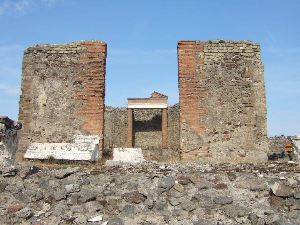 VII.4.1 Pompeii. September 2005. Podium, looking east to cella, or sacred area.
According to Warscher in 1930 -
an inscription on the architrave could be read by any visitor knowing Latin, as it was lying with other marble pieces on the floor of the cella.
See Warscher, T., 1930. Pompeii: in three hours. Rome: Industria Tipografica Imperia, (p.55).

In February 1824, it was reported that various fragments of statues and four inscriptions upon different pieces of marble were also found.
See Fiorelli G., 1862. Pompeianarum antiquitatum historia, Vol. 2: 1819 - 1860, Naples, p. 96.
See Pagano, M. and Prisciandaro, R., 2006. Studio sulle provenienze degli oggetti rinvenuti negli scavi borbonici del regno di Napoli. Naples: Nicola Longobardi. (p.128).

