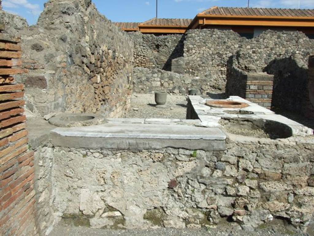 VII.4.4  Pompeii. March 2009.  Two sided counter, with remains of three large urns and one small one.