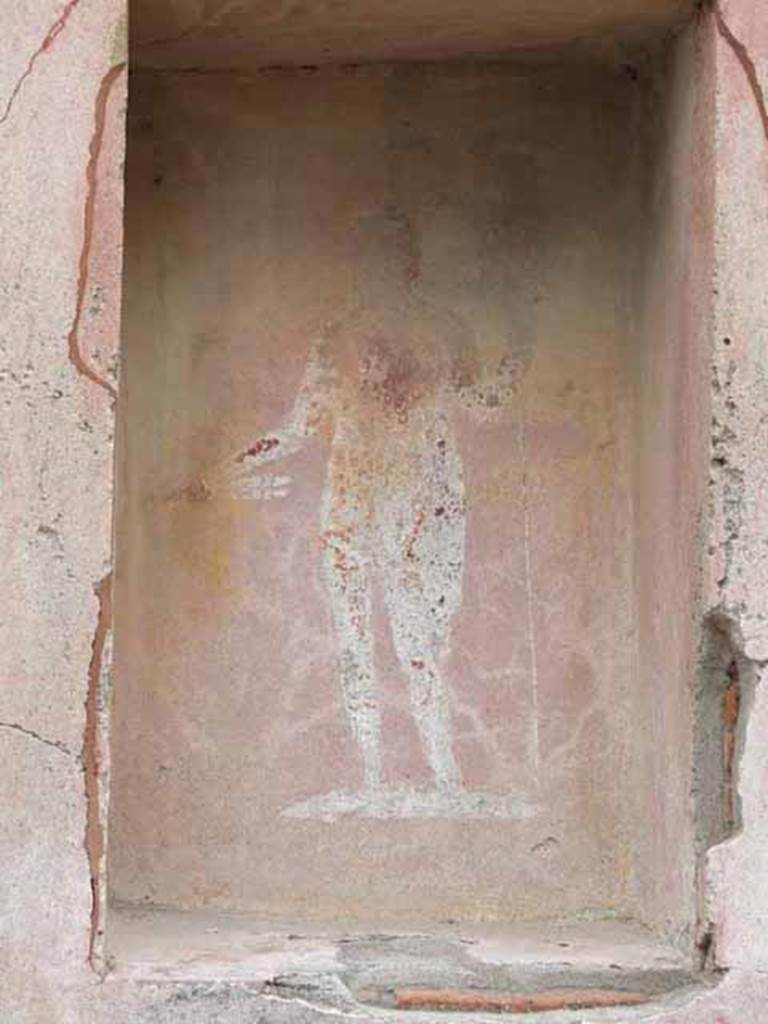VII.4.17 Pompeii.  May 2010. Street shrine with a picture of Jupiter with thunderbolt and sceptre, on left pillar of VII.4.17. 
See Fr�hlich, T., 1991, Lararien und Fassadenbilder in den Vesuvst�dten.  Mainz: von Zabern.  (F48: p.325).
See Eschebach, L., 1993, Geb�udeverzeichnis und Stadtplan der antiken Stadt Pompeji.  K�ln: B�hlau.  (p.275).
See Boyce G. K., 1937. Corpus of the Lararia of Pompeii. Rome: MAAR 14. (p.111, no. 15) 

