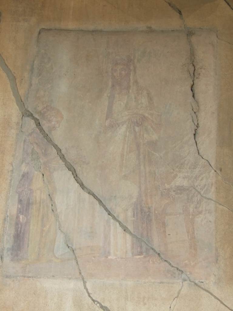 VII.4.31 Pompeii.  March 2009. Room 29. Apsidal Exedra.  Wall painting of A priestess receiving the offerings from a maid to deposit upon the altar.

