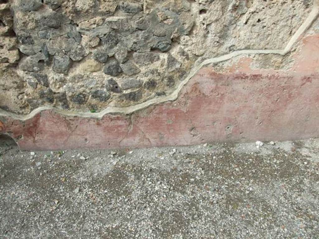 VII.4.48 Pompeii. March 2009. Room 2. Atrium. North wall, east side of entrance. Remains of painted plaster.