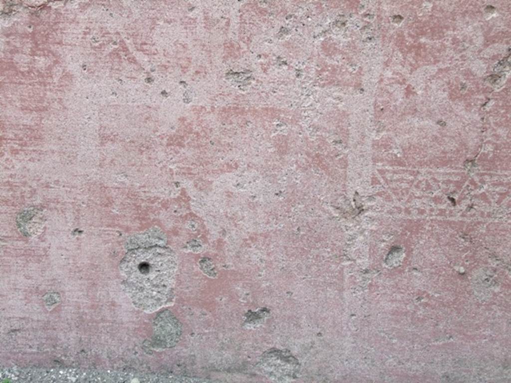 VII.4.48 Pompeii. March 2009. Room 2. Atrium. North wall. Painted plaster with faded decoration.