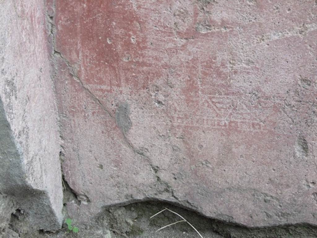 VII.4.48 Pompeii. March 2009. Room 2. Atrium. North wall. Painted plaster with faded decoration.