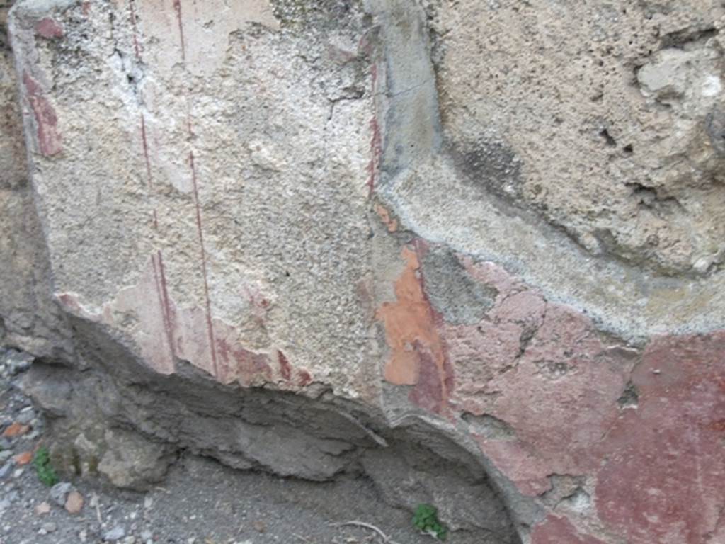 VII.4.48 Pompeii. March 2009. Room 2. Atrium. North wall. Painted plaster with faded decoration.