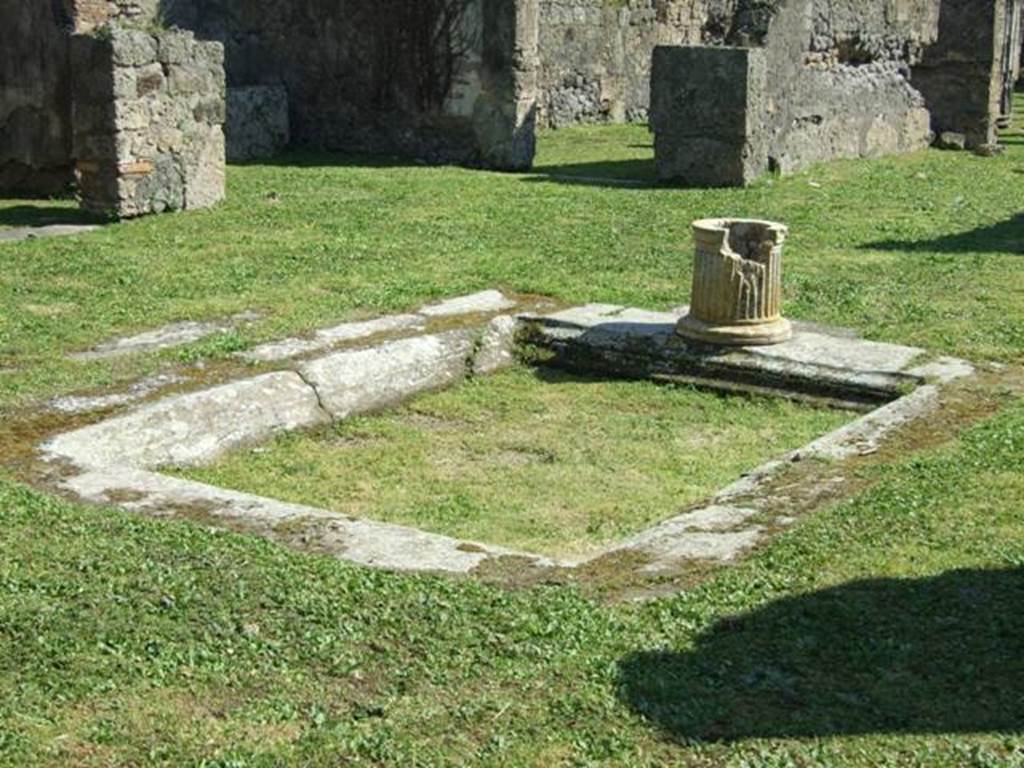 VII.4.57 Pompeii. March 2009. Room 1, impluvium with marble puteal in atrium.