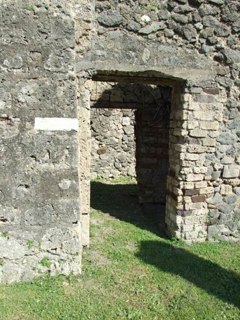 VII.4.57. Pompeii. March 2009. Doorway to Room 16. Kitchen, Latrine and stairs to upper floor.
