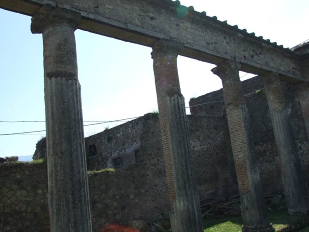 Peristyle.  West wall.  Peristyle.  Columns on south side, showing masonry inner core.