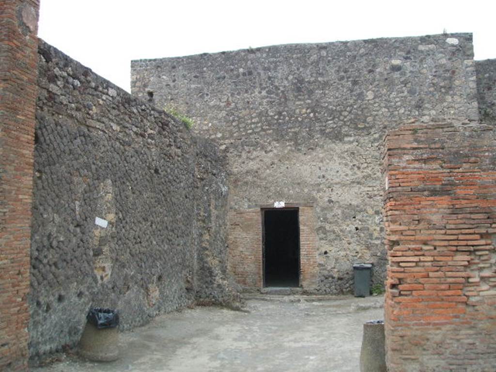 VII.5.3 Pompeii. May 2005. Shop with modern exit from Forum Baths.
A description, and photograph (figure 15 on page 138) can be found on page 137-8 of Associazione Internazionale Amici di Pompei: Quaderni di Studi Pompeiani, 1/2007.
Barattolo, A and Romaldi, F: Insula VII.5 � Una rilettura ragionata dei documenti grafici. (p.127-146)
