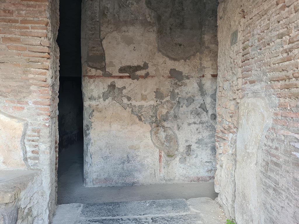 VII.5.8 Pompeii. October 2024. 
Looking south from entrance doorway to corridor (45), centre left. Photo courtesy of Klaus Heese.
