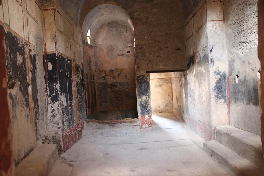 VII.5.8 Pompeii. October 2024.
Looking north across changing room (46), towards Piscina (48), in centre, with square doorway to corridor (45), on right.
Photo courtesy of Klaus Heese.
