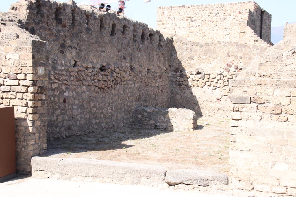 VII.7.1 Pompeii. October 2023. Looking north-west across entrance doorway of shop. Photo courtesy of Klaus Heese.