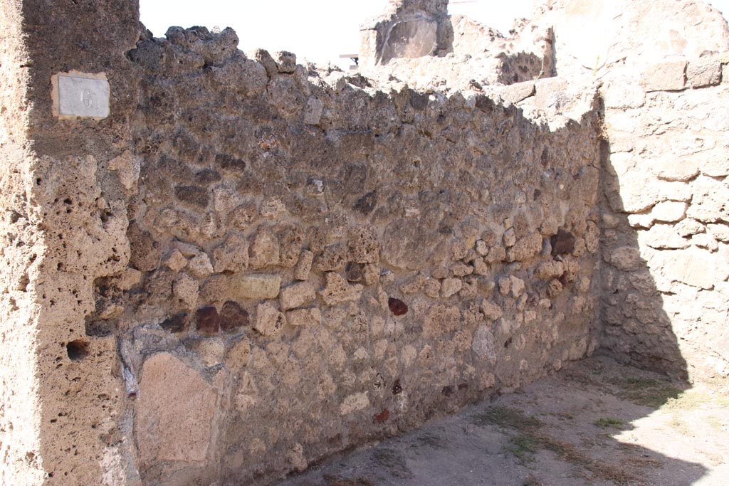 VII.7.6 Pompeii. October 2023. West wall of shop-room. Photo courtesy of Klaus Heese.