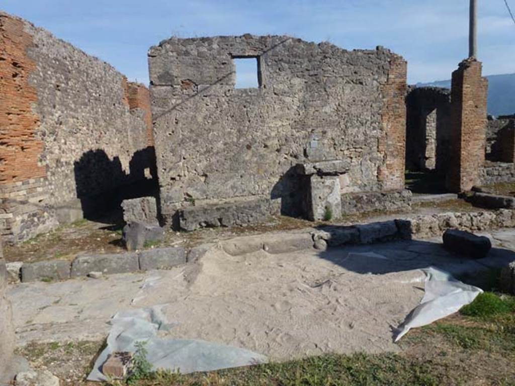 VII.7.22 Pompeii. June 2012. Looking south across Vicolo dei Soprastanti to Jupiter altar.