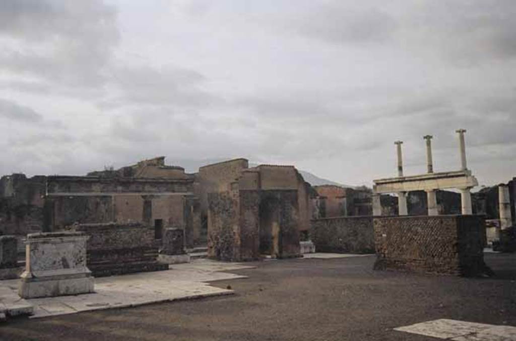 VII.8 Pompeii Forum. January 2009. Looking south towards south-west corner. Photo courtesy of Rick Bauer. According to Mau, the four monuments arranged in a group with the arched monument at the centre were of the imperial family
