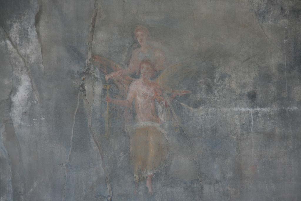 VII.9.7 and VII.9.8 Pompeii. Macellum. April 2013.  
North-west corner. Detail of female flying figures, one with wings, from west wall. Photo courtesy of Klaus Heese.

