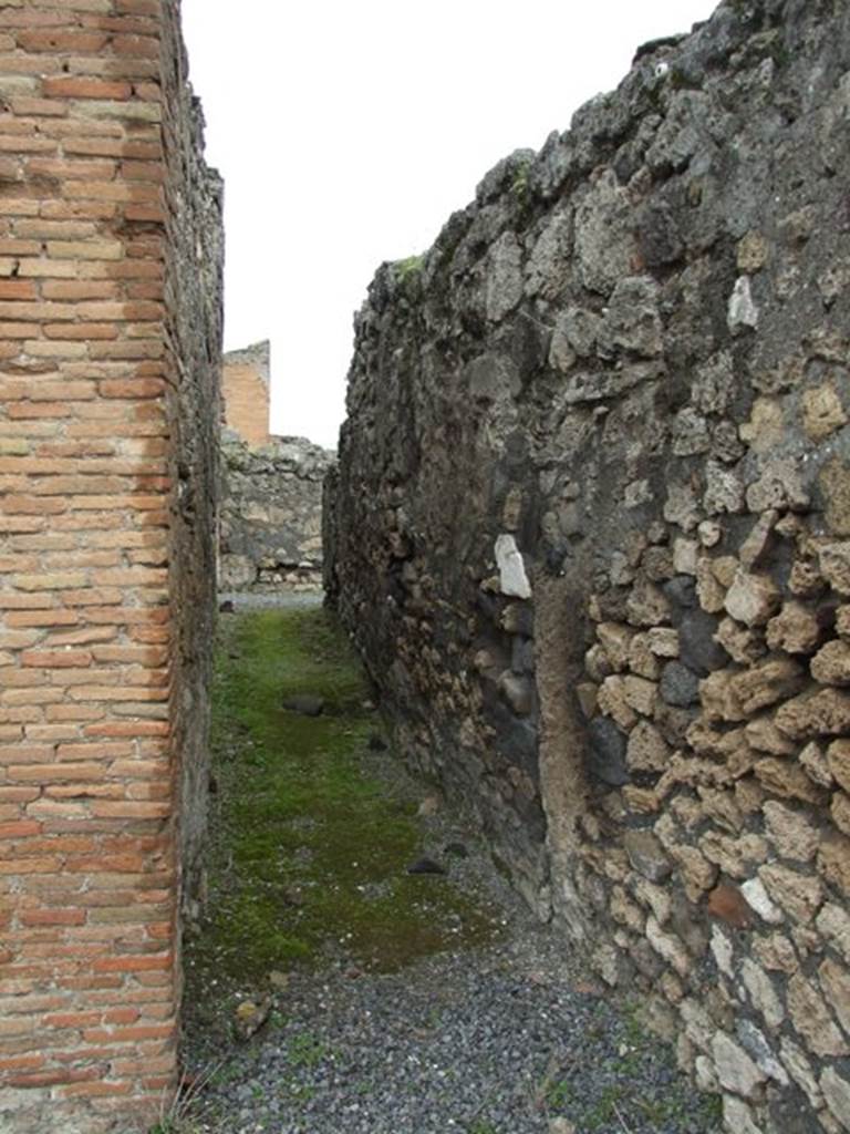 VII.9.47 Pompeii. March 2009. Room 13. Looking north along Corridor from Peristyle to Services area.