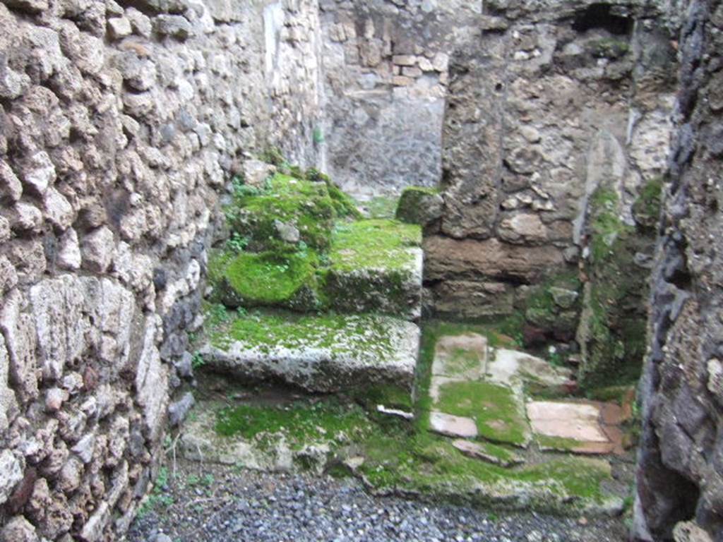 VII.9.64 Pompeii. December 2005. Steps to upper floor in north-west corner, and latrine in north-east.