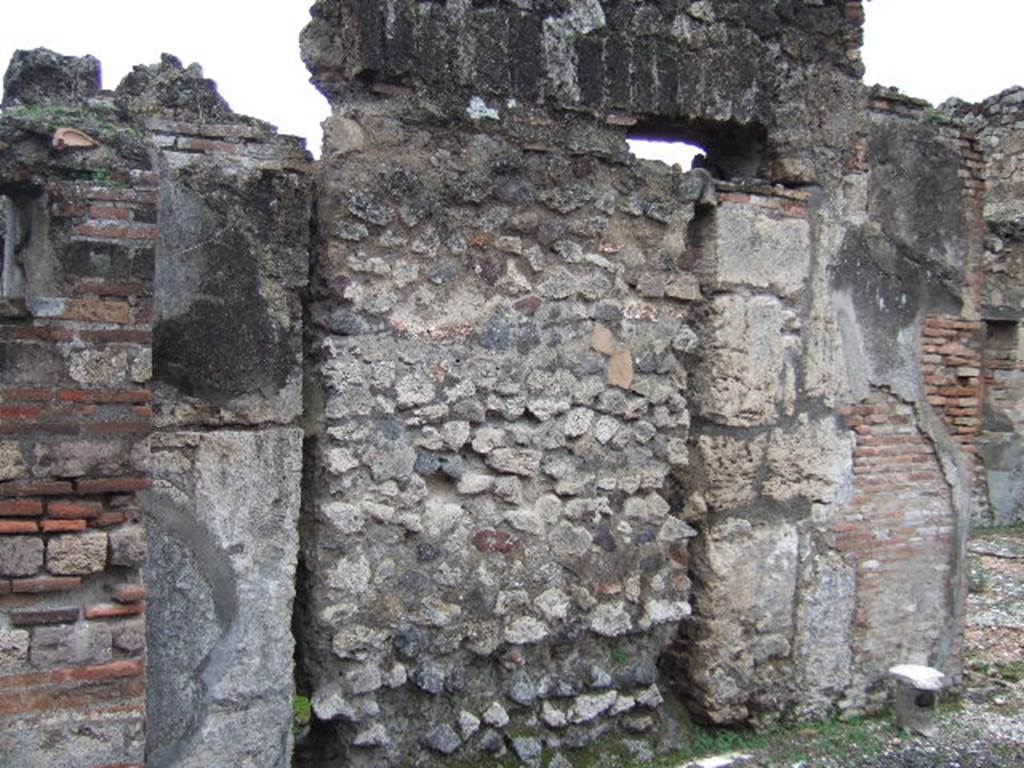 VII.10.5 Pompeii. December 2005. Wall and blocked doorway to atrium, in south-west corner of peristyle.