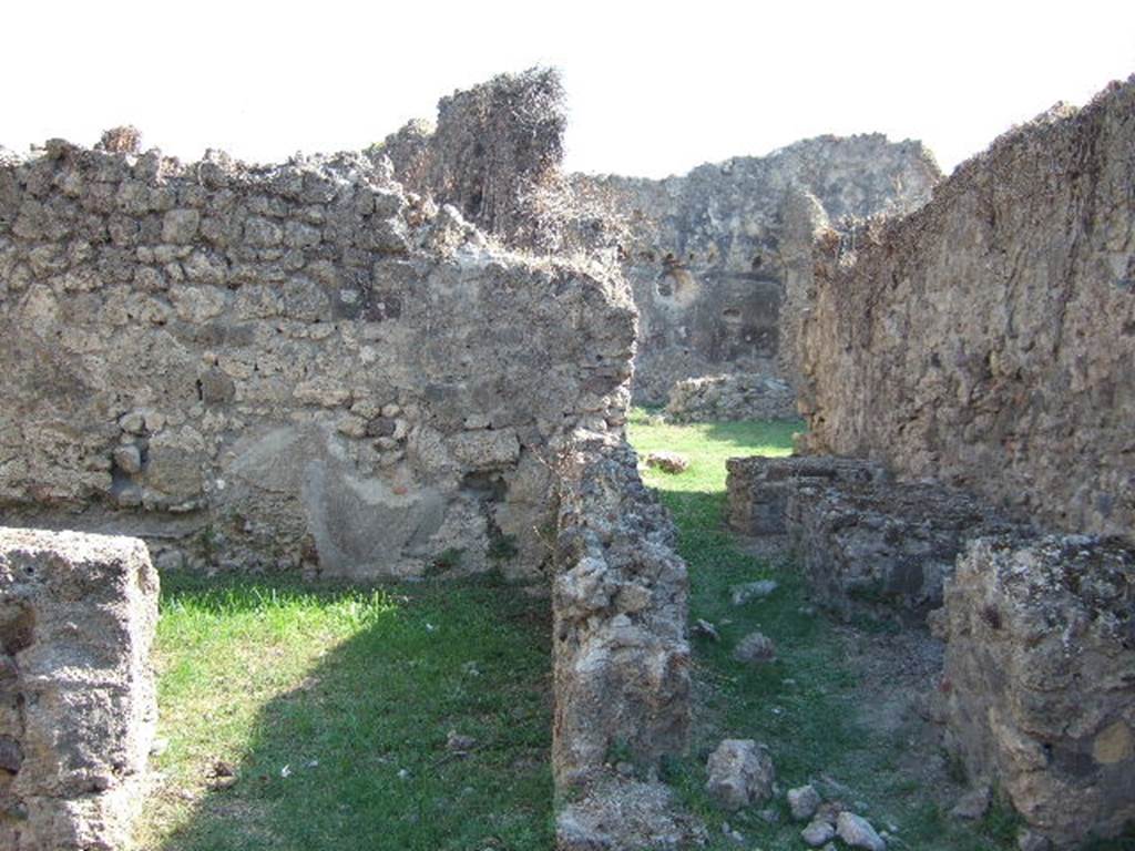 VII.12.13 Pompeii.  September 2005.  Rear room of shop and corridor to bakery area.