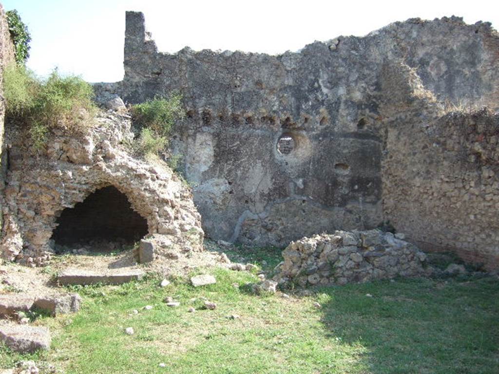 VII.12.13 Pompeii.  September 2005.  South wall with oven and bakery area.